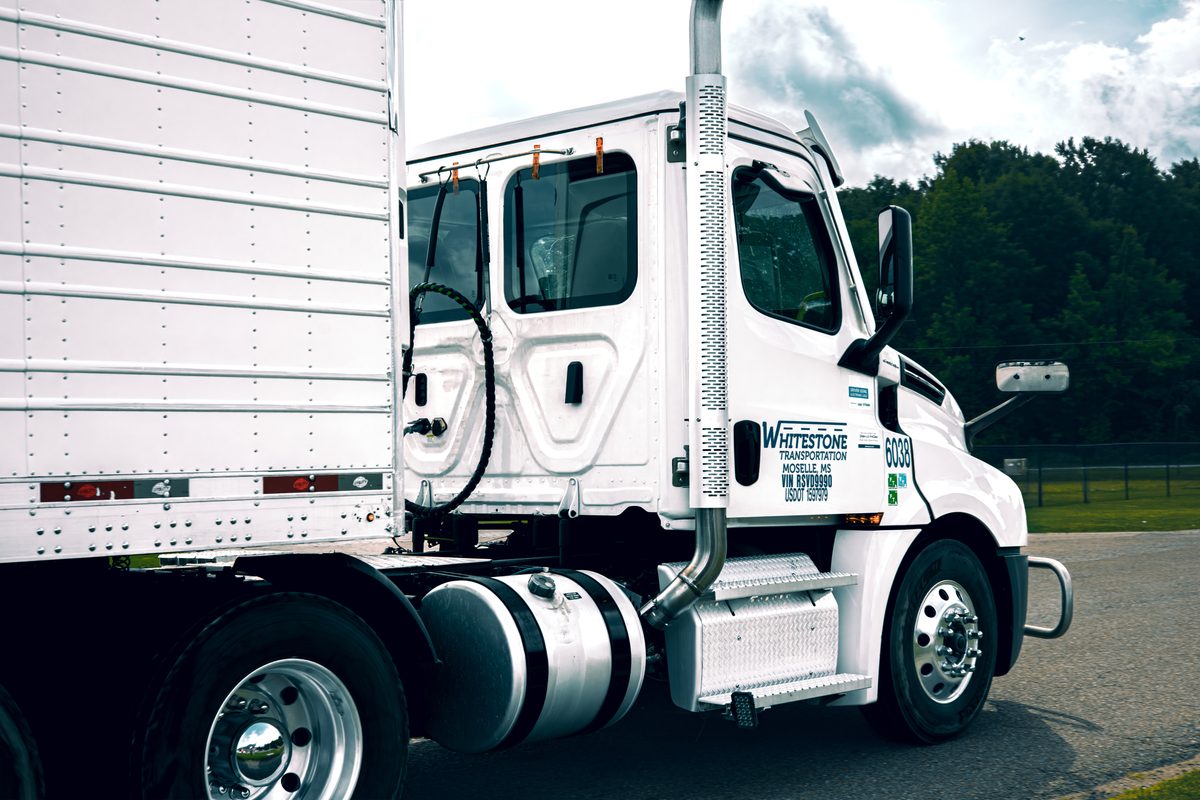 Whitestone Transportation Freightliner day cab and dry van trailer